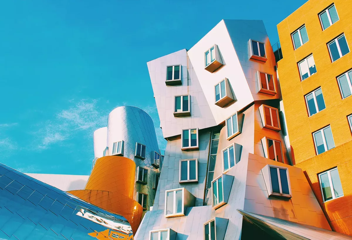Modern architectural building with colorful panels against a blue sky.